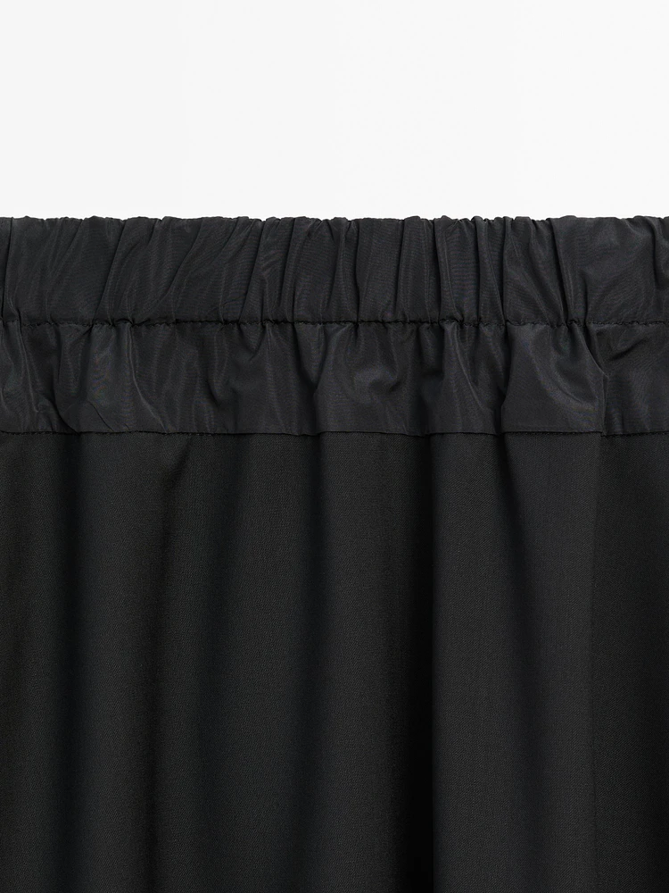 Technical fabric skirt with wool