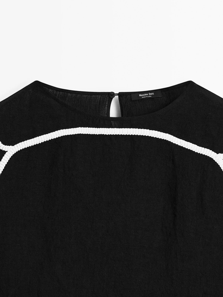 Blouse with contrast embroidery
