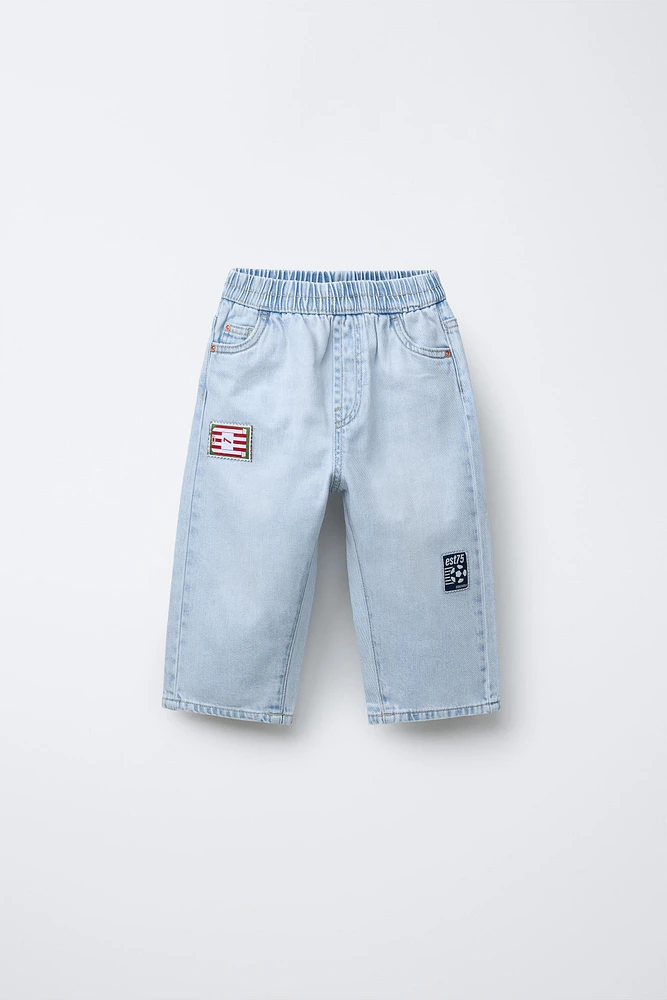 JEAN WIDE LEG À PIÈCES