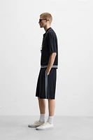 POLO EN MAILLE À POCHE