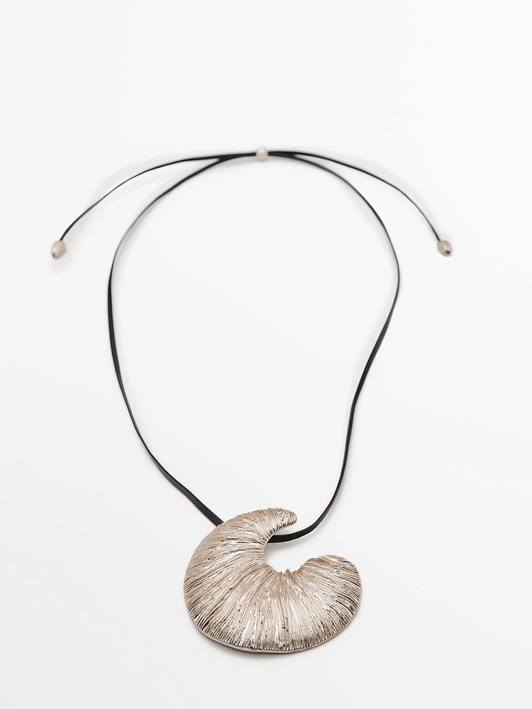Necklace with fossil piece pendant