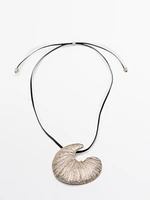 Necklace with fossil piece pendant