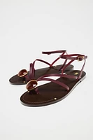 FLAT LEATHER SANDALS WITH DECORATIVE STRAPS