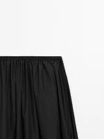 Long flared skirt with gathered detail