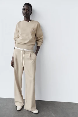 BROOCH SWEATSHIRT