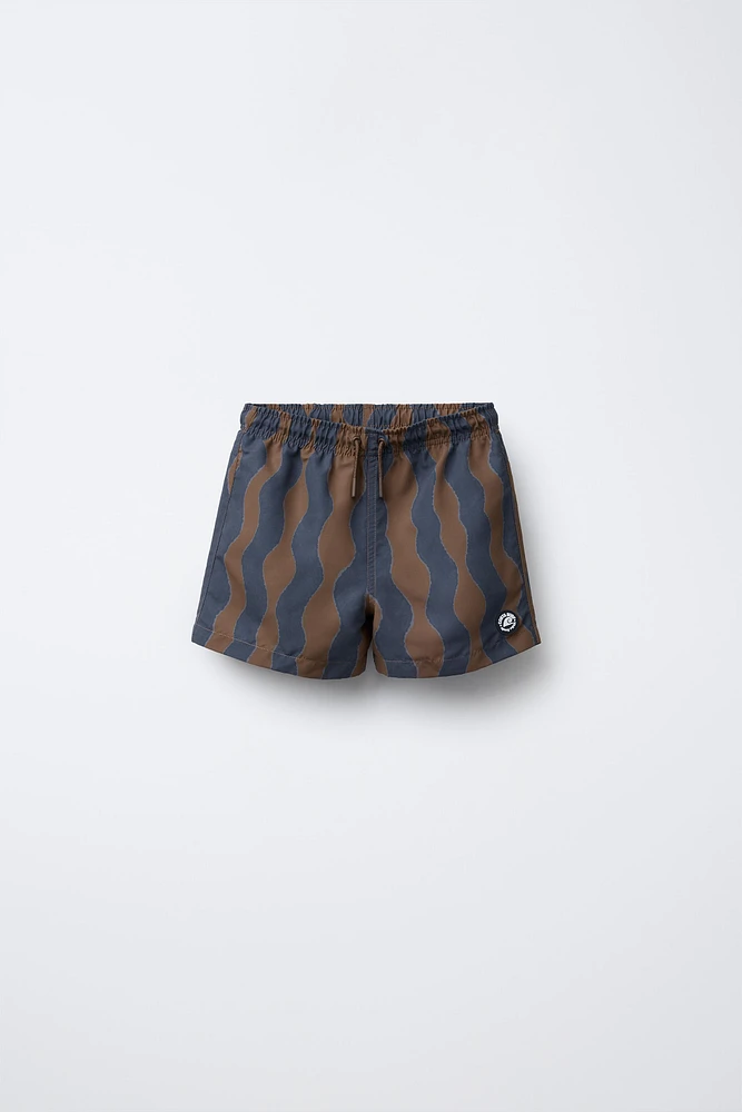 6-14 YEARS/ WAVE PRINT SWIM SHORTS