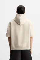 SWEAT TECHNIQUE À CAPUCHE