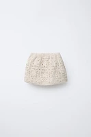 JUPE EN MAILLE AU CROCHET