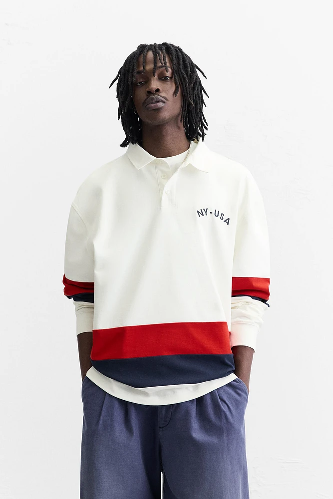 POLO WITH CONTRASTING SIDE STRIPE