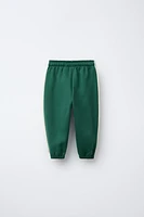PANTALON DE JOGGING AVEC INSCRIPTION BRODÉE