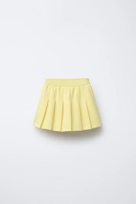 JUPE-SHORT BERMUDA TECHNIQUE PLIS PLATS