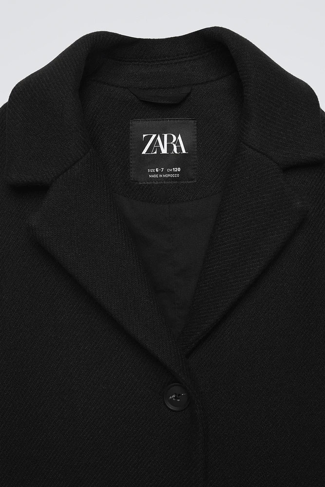 MANTEAU CONTENANT DE LA LAINE