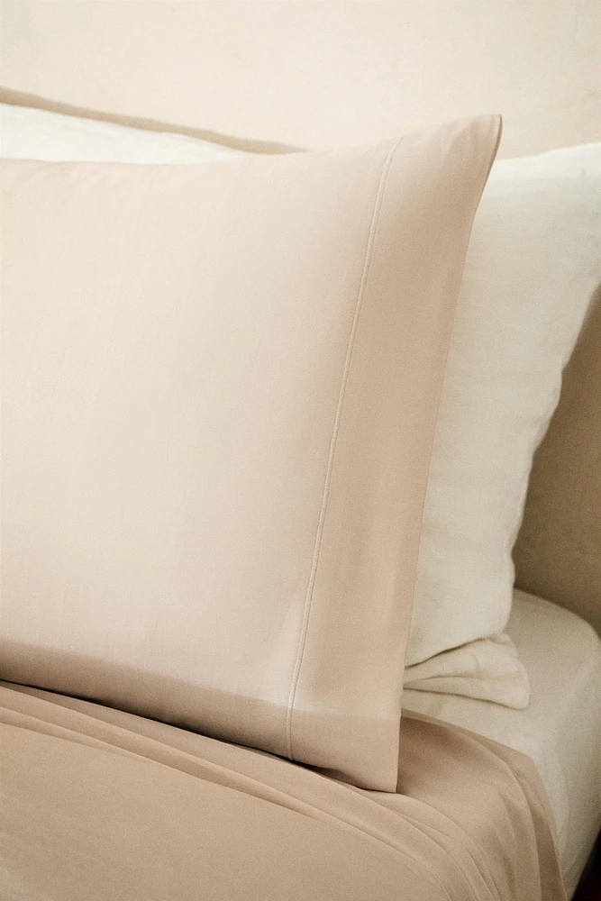 TAIE D’OREILLER SATIN FESTON (300 FILS)