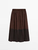 Long flowing pleated skirt