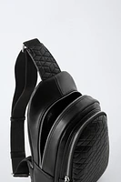 EMBOSSED CROSSBODY BACKPACK