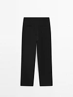 Pantalon avec boutons dans le bas