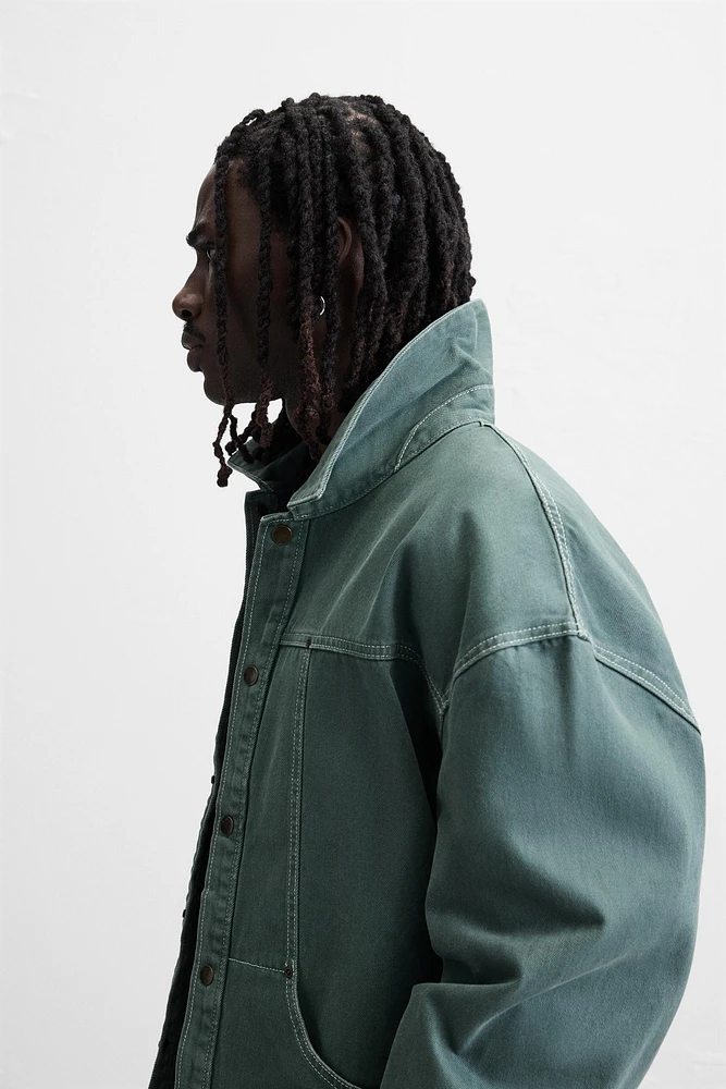 VESTE DÉLAVÉE SURPIQÛRES CONTRASTÉES