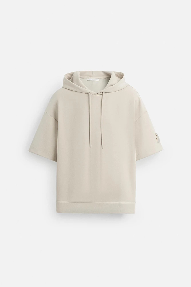SWEAT TECHNIQUE À CAPUCHE