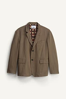 VESTE BOXY FIT COSTUME ÉDITION LIMITÉE