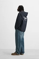 BLOUSON TECHNIQUE À CAPUCHE