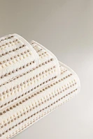 TEXTURED POLKA DOT BATH TOWEL