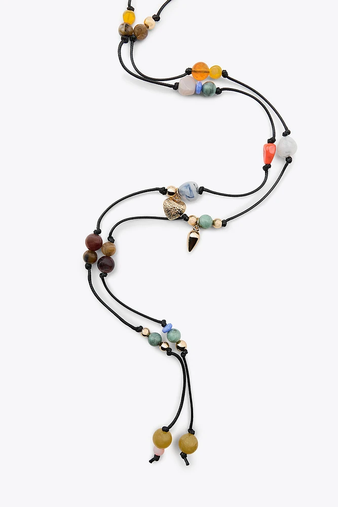 MULTI-POSITION BEADED CORD NECKLACE