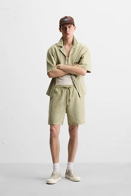 TEXTURED EMBROIDERED SHORTS