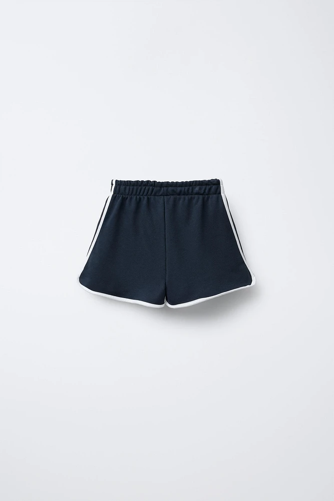 VARSITY PRINTED PLUSH SHORTS
