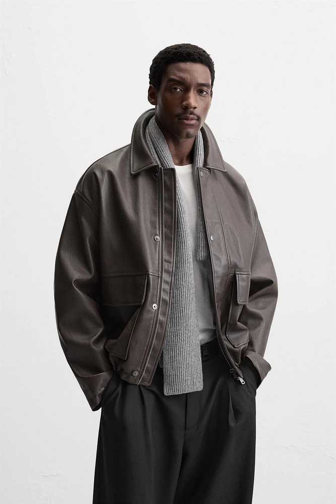 BLOUSON EN MATIÈRE SYNTHÉTIQUE
