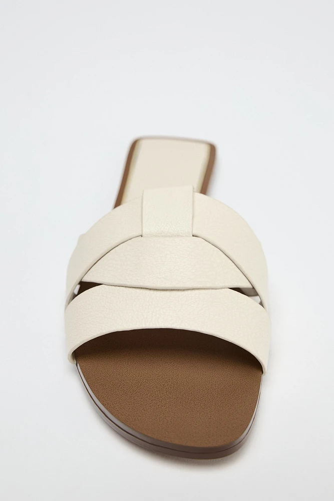 FLAT CROSSED LEATHER SANDALS