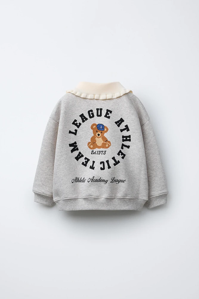 SWEAT À COL EN MATIÈRES VARIÉES BRODÉ
