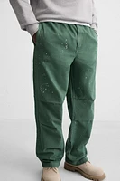PANTALON PARACHUTE À ÉCLABOUSSURES