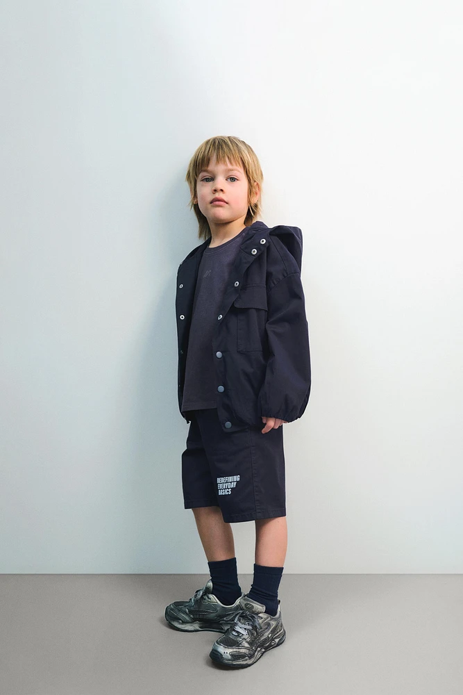 BLOUSON À CAPUCHE AVEC LOGO