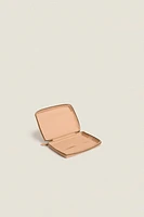 TROUSSE EN CUIR