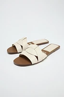 FLAT CROSSED LEATHER SANDALS