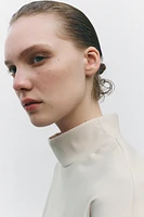 TOP VOLUMINEUX À ZIP