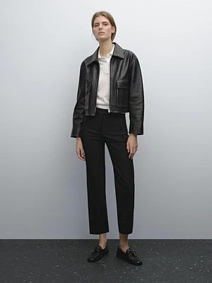 Pantalon avec boutons dans le bas