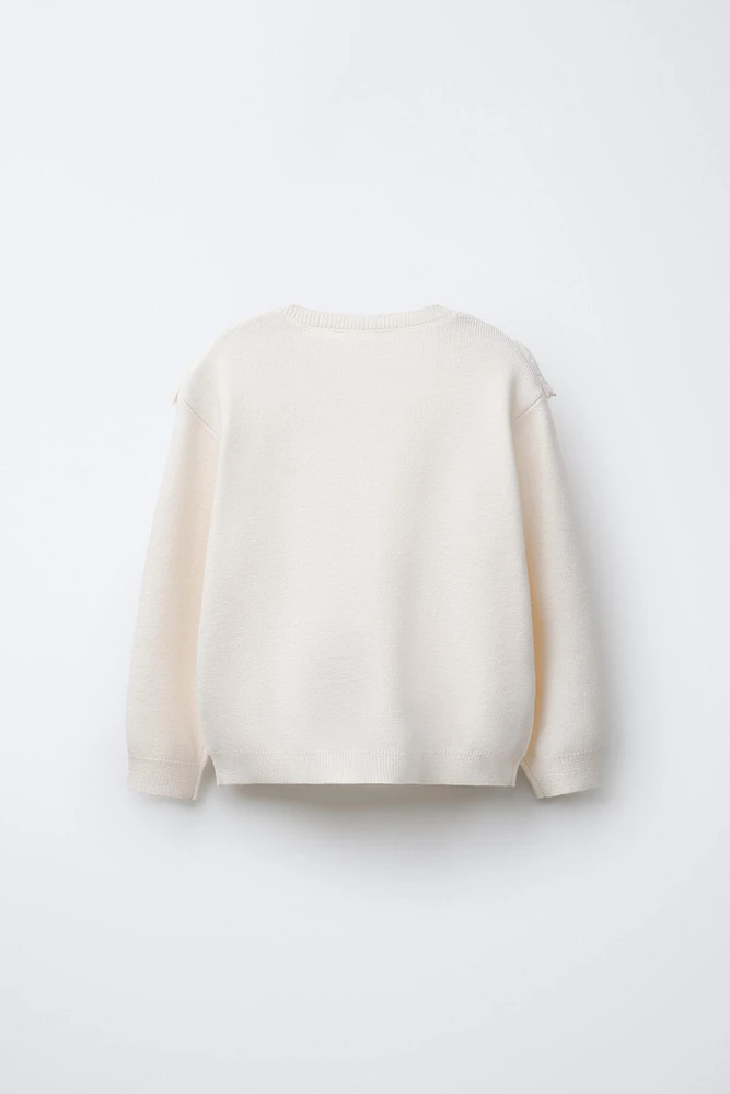 PULL EN MAILLE AVEC DÉTAIL DE DENTELLE BRODÉE