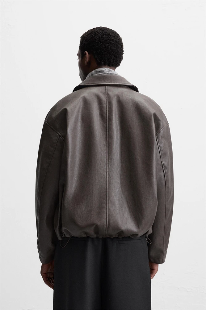BLOUSON EN MATIÈRE SYNTHÉTIQUE