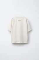 TEXTURED RAISED TEXT T-SHIRT