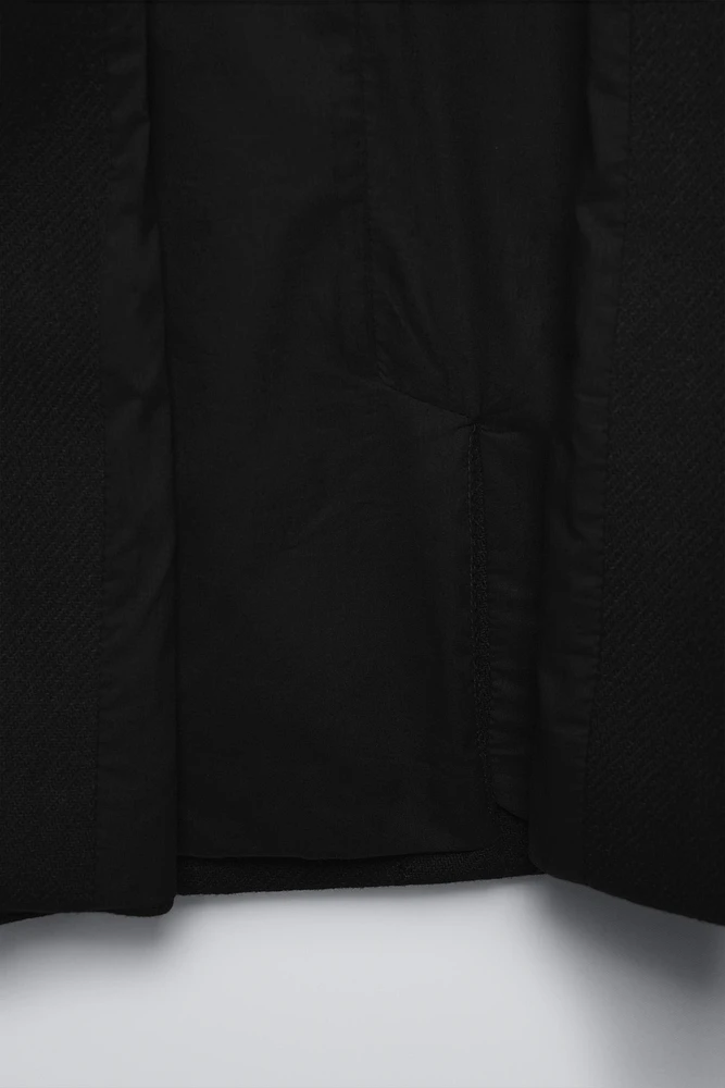 MANTEAU CONTENANT DE LA LAINE