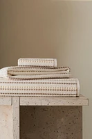 TEXTURED POLKA DOT BATH TOWEL