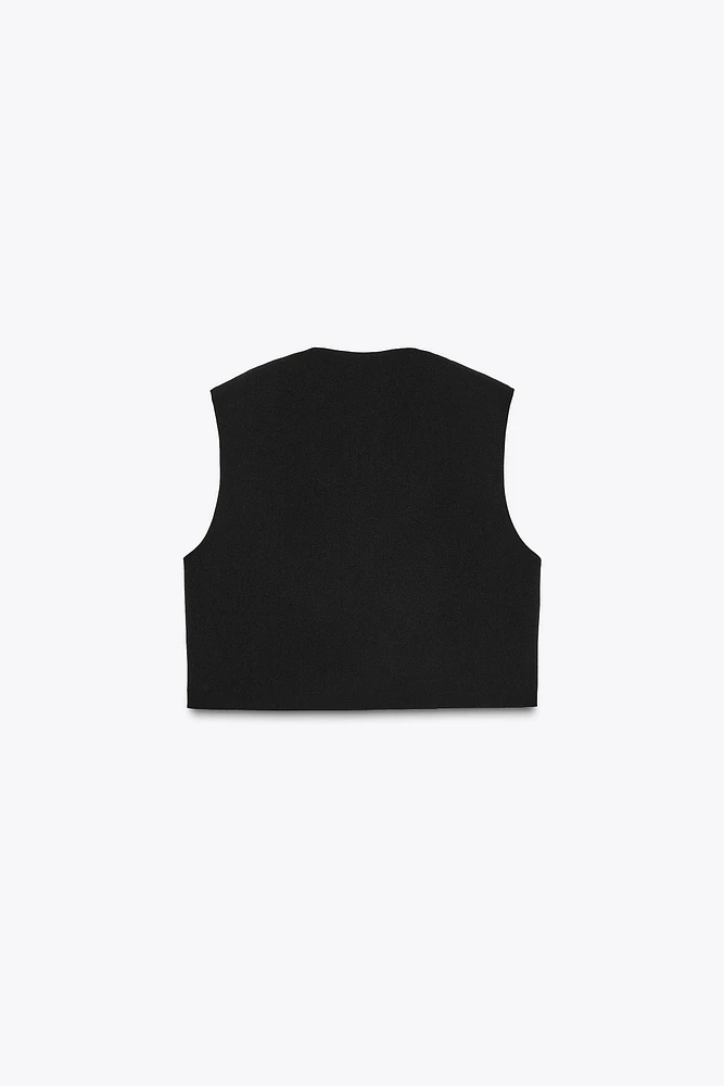 GILET COURT À FERMETURE MÉTALLIQUE