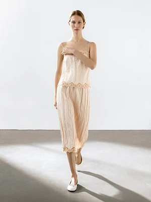 Flowing midi skirt with blonde lace detail