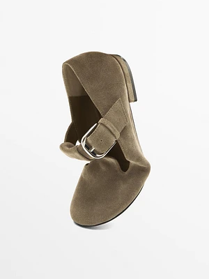 Flat shoes with buckled strap
