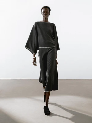 Cape blouse with batwing sleeves