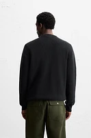 PULL EN MAILLE PERLÉE À BOUTONS