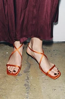 SATIN-EFFECT CROSSED STRAP SANDALS