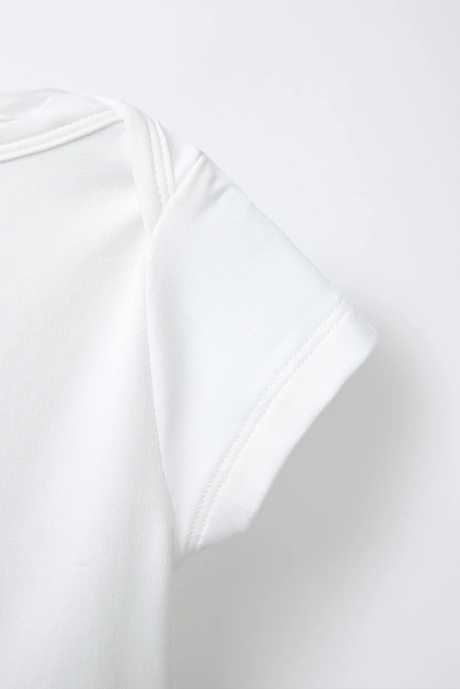 TOP CROPPED UNI ÉLASTIQUE