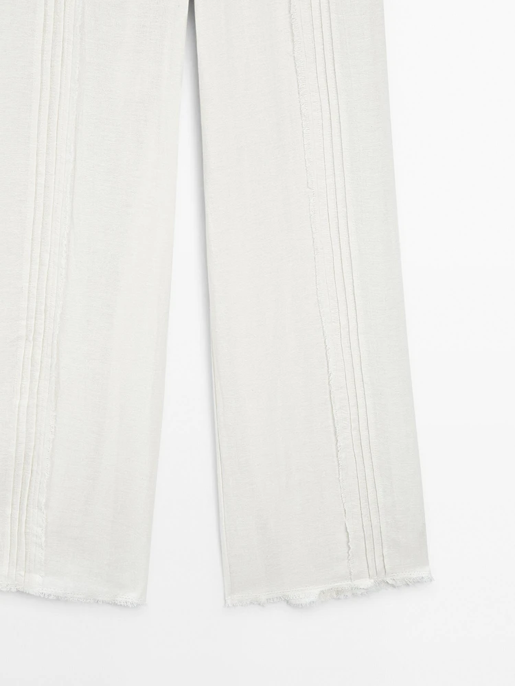 Pantalon avec broderies en coton mélangé